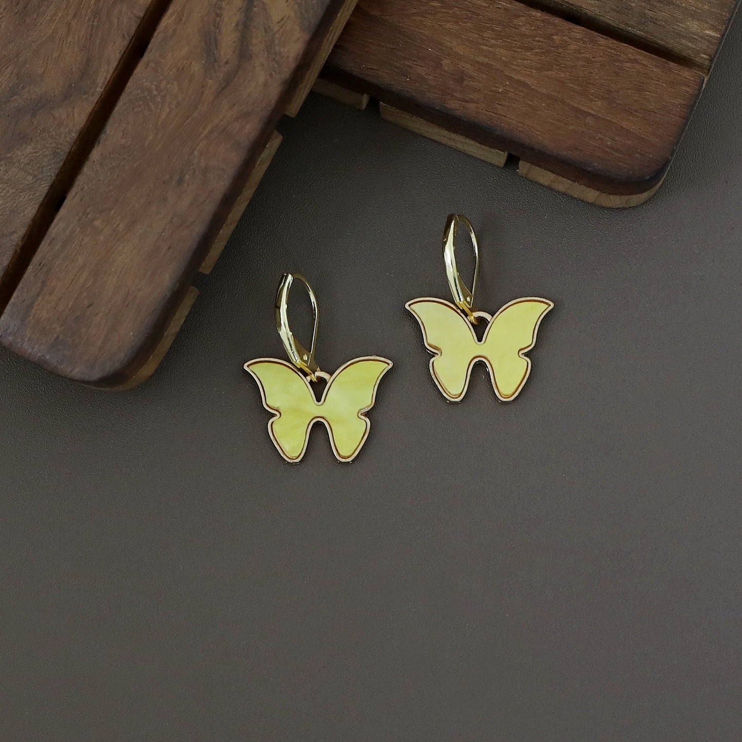 Butterfly neckpiece with hoop earrings